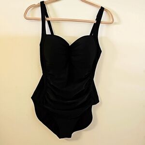 Immerse black one peice bathing suit.  Size 8. Flattering roughing. No wire.